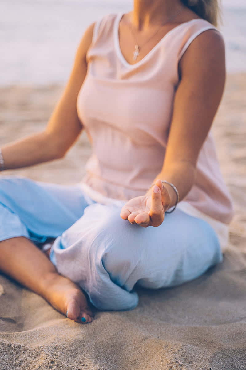 Caption: Mindful Practice - Woman Engaged In Yoga Background