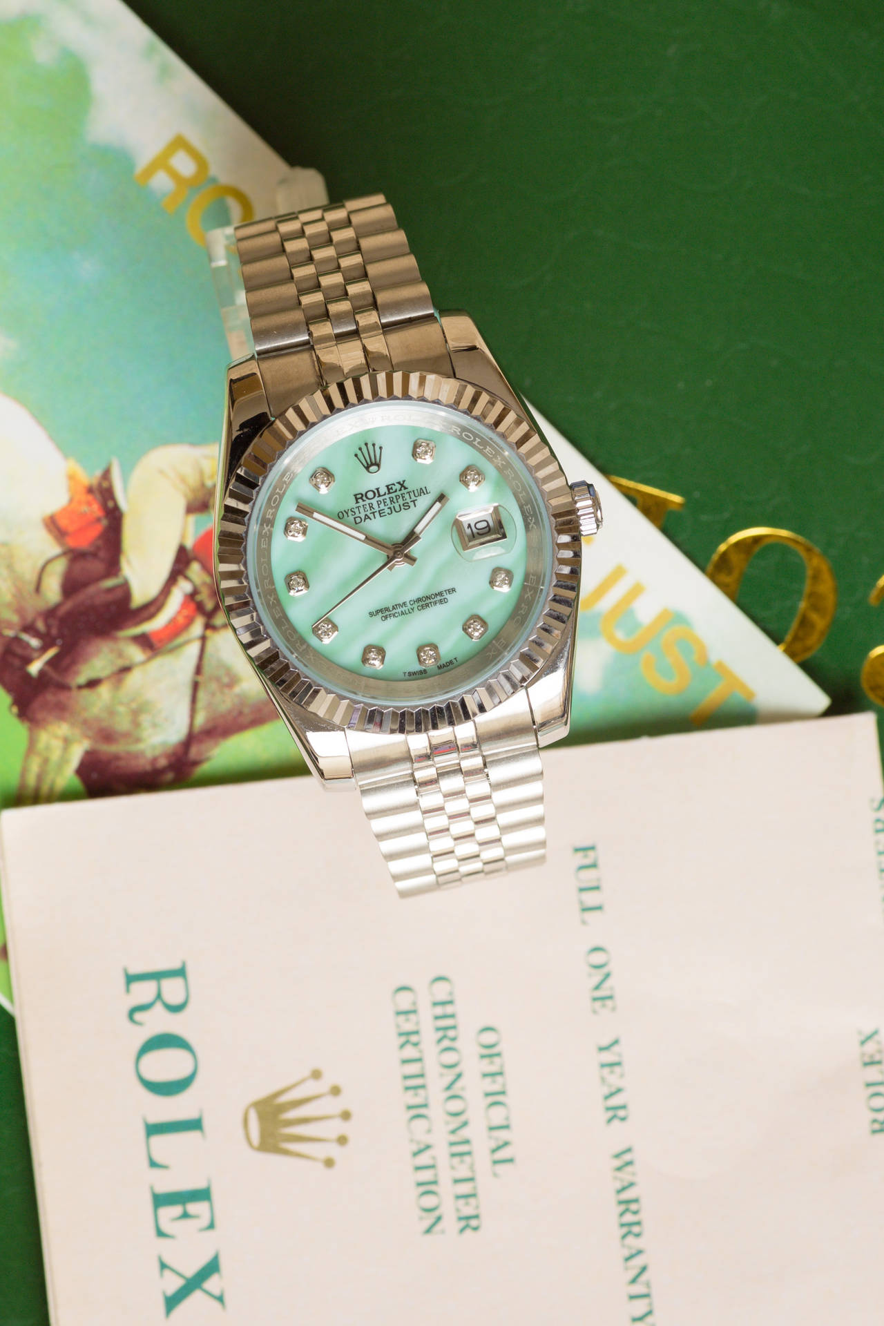 Caption: Mint Green Rolex Watch - A Classic Timepiece Of Luxury And Style Background