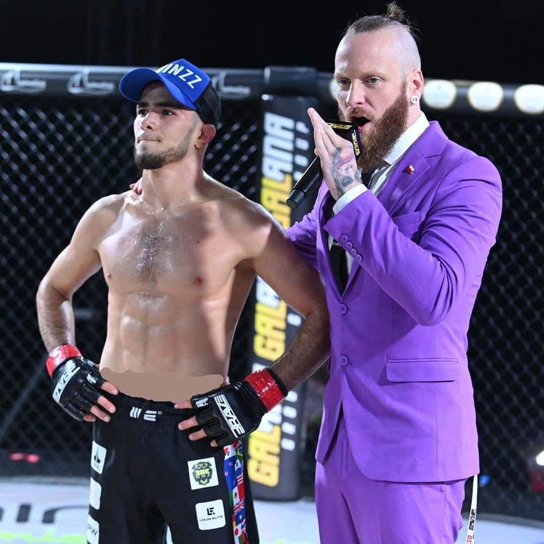 Caption: Mma Fighter Muhammad Mokaev Entering The Stage Background