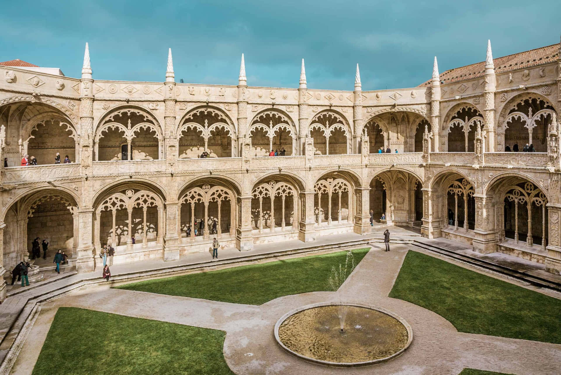Caption: Mosteiro Dos Jeronimos Inner Courtyard - Architectural Marvel In Portugal Background