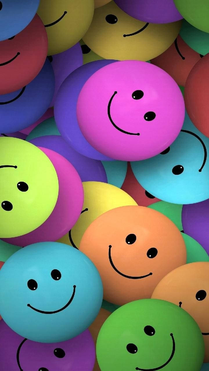Caption: Multicolored Array Of Smiley Faces Background