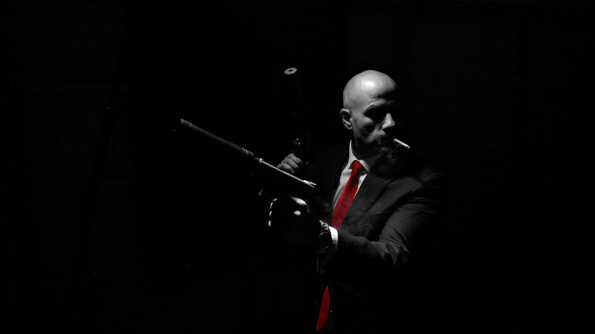 Caption: Mysterious Real Hitman In Dark Backdrop