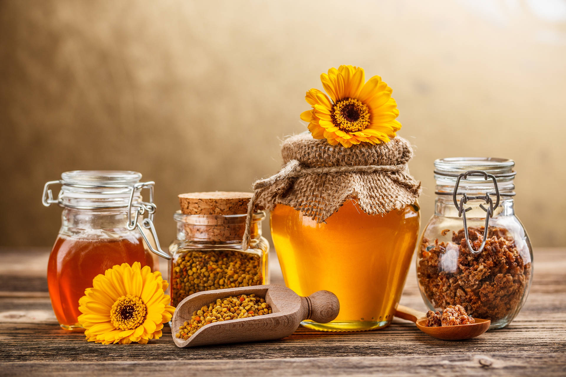 Caption: Natural Honey In Jars With Bee Pollen Background