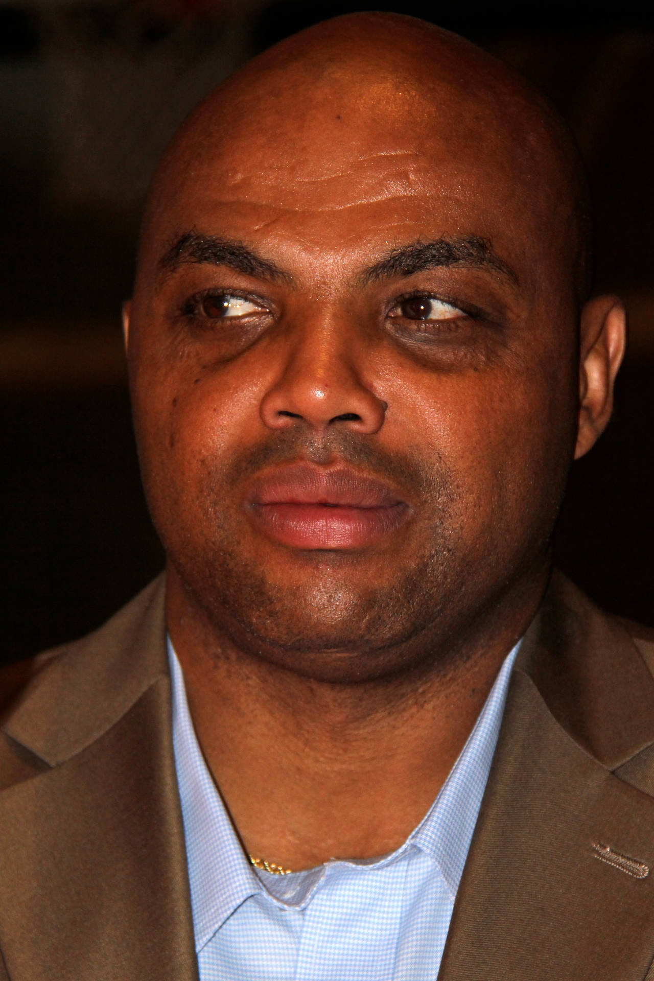 Caption: Nba Legend Charles Barkley Showing His Poker Face Background