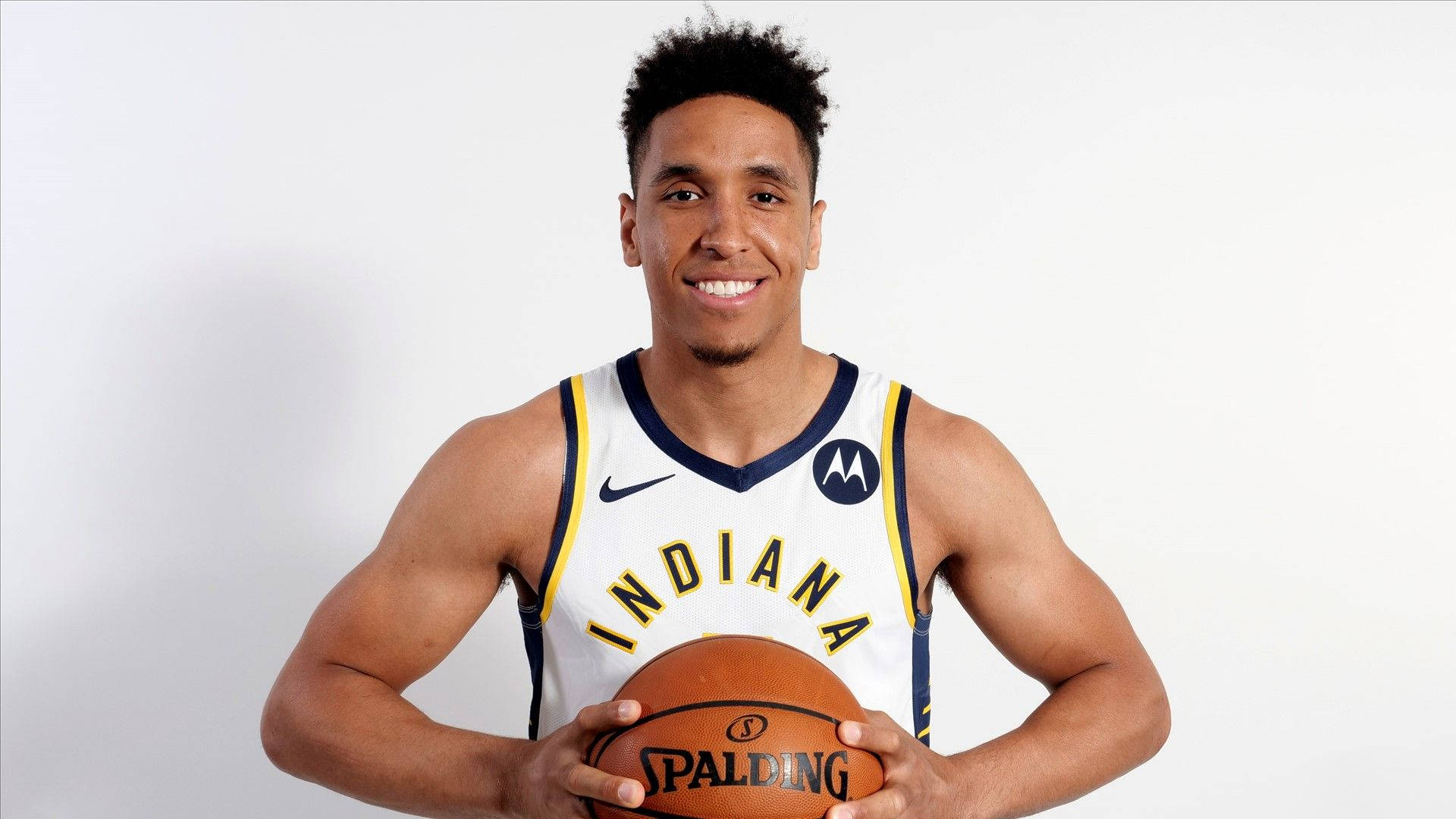 Caption: Nba Star Malcolm Brogdon In Action Background