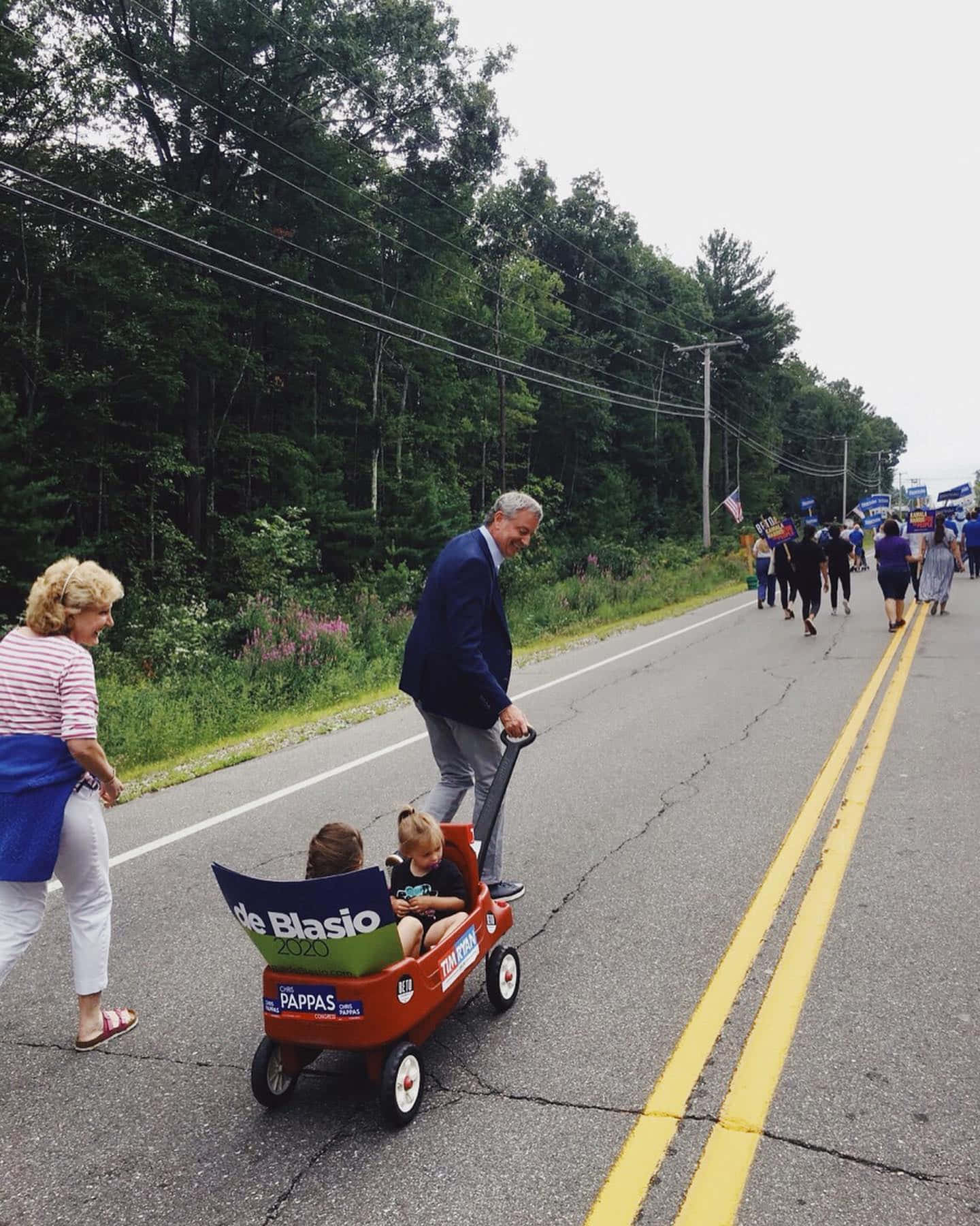 Caption: New York Mayor Bill De Blasio Pulling A Trolley