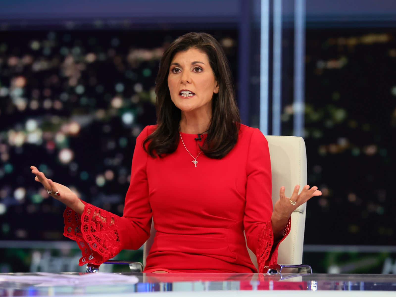 Caption: Nikki Haley Speaking At A Conference Background