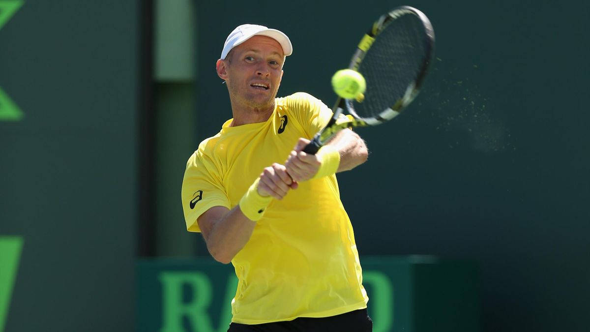 Caption: Nikolay Davydenko In Action With A Two-handed Swing Background