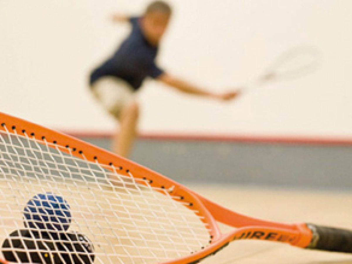 Caption: Orange Squash Racket Lifelike Image. Background