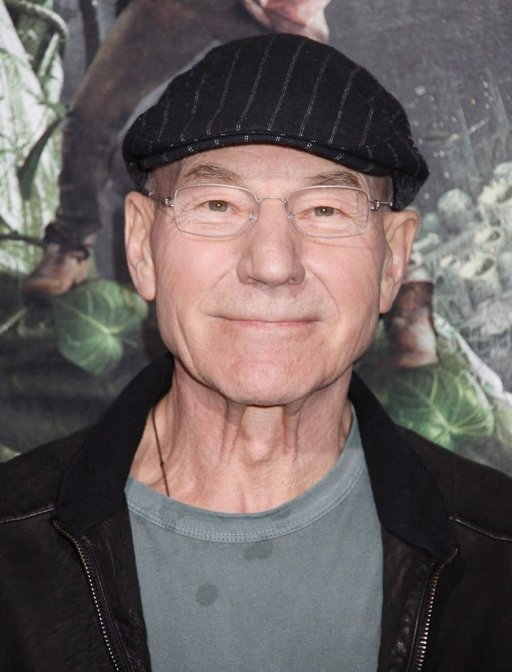 Caption: Patrick Stewart Looking Dapper In Flat Cap Background