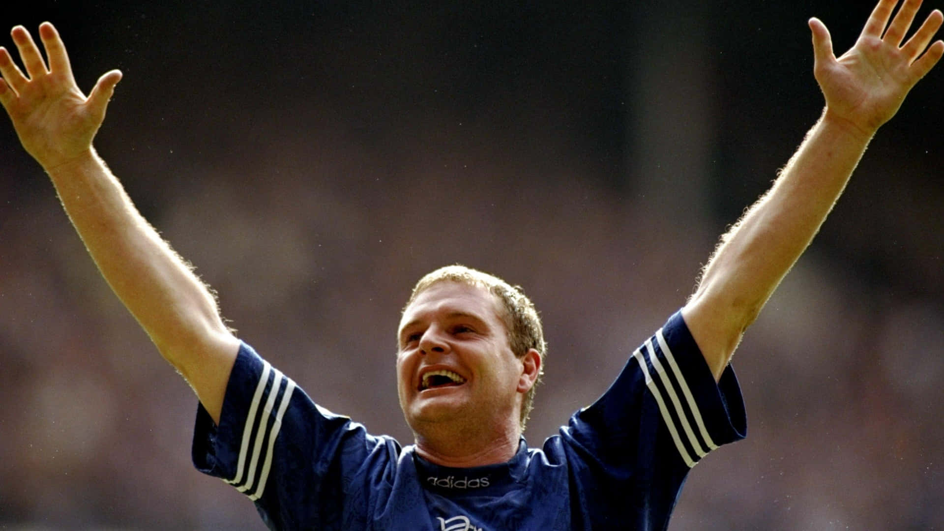 Caption: Paul Gascoigne Showcasing His Stellar Football Skills On The Field Background