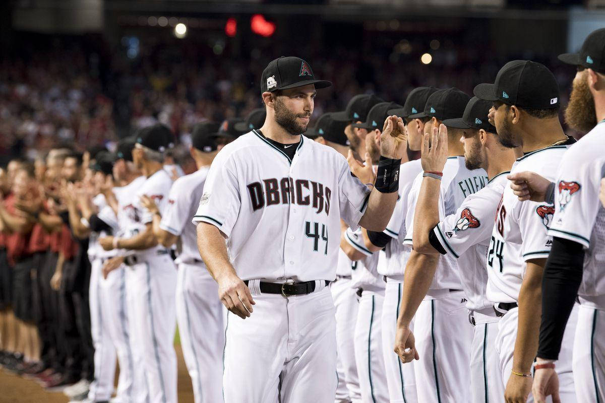 Caption: Paul Goldschmidt Celebrating A Winning Moment With Teammates Background