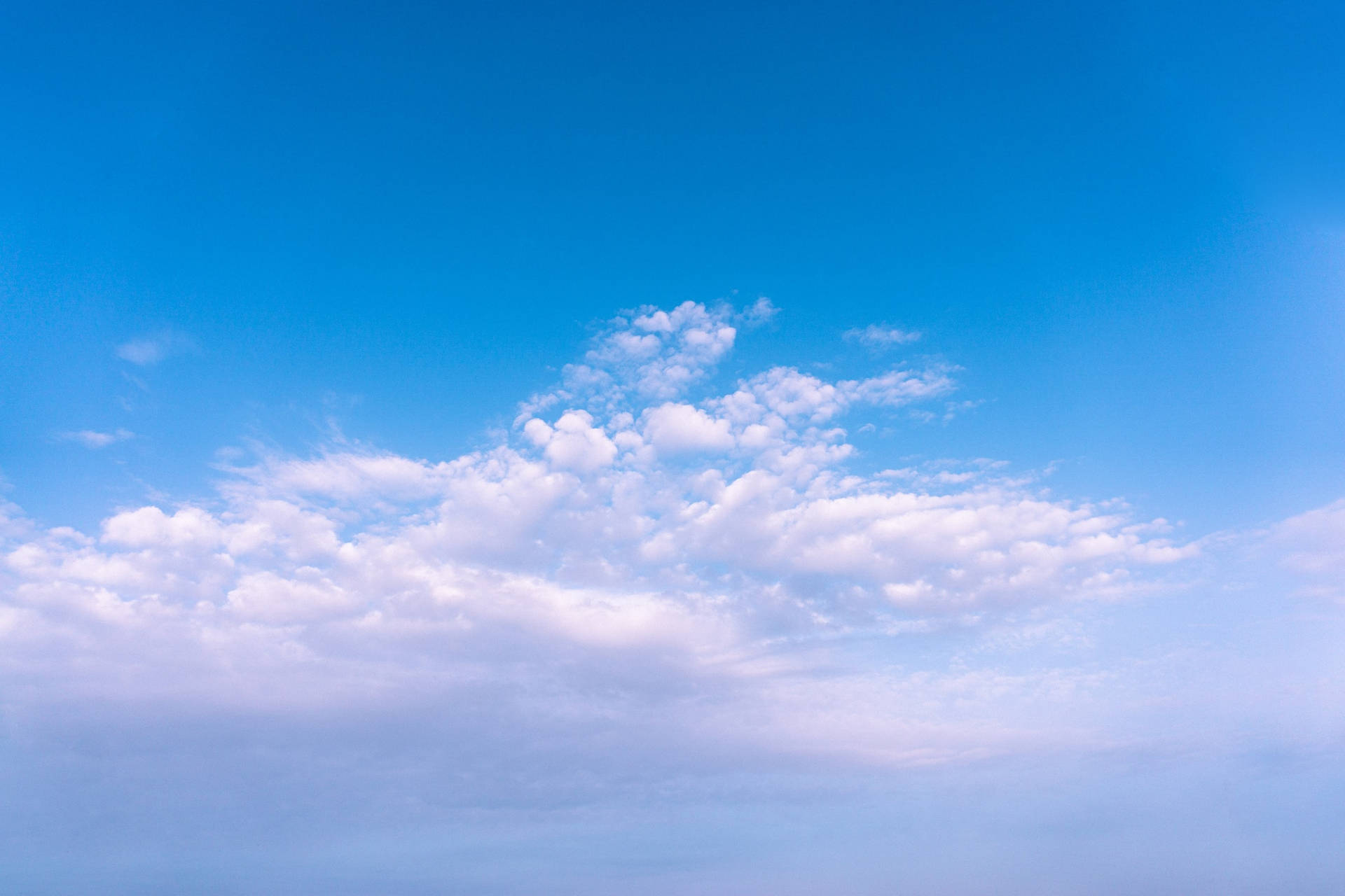 Caption: Peaceful Sunny Day Under The Cloudy Sky Background