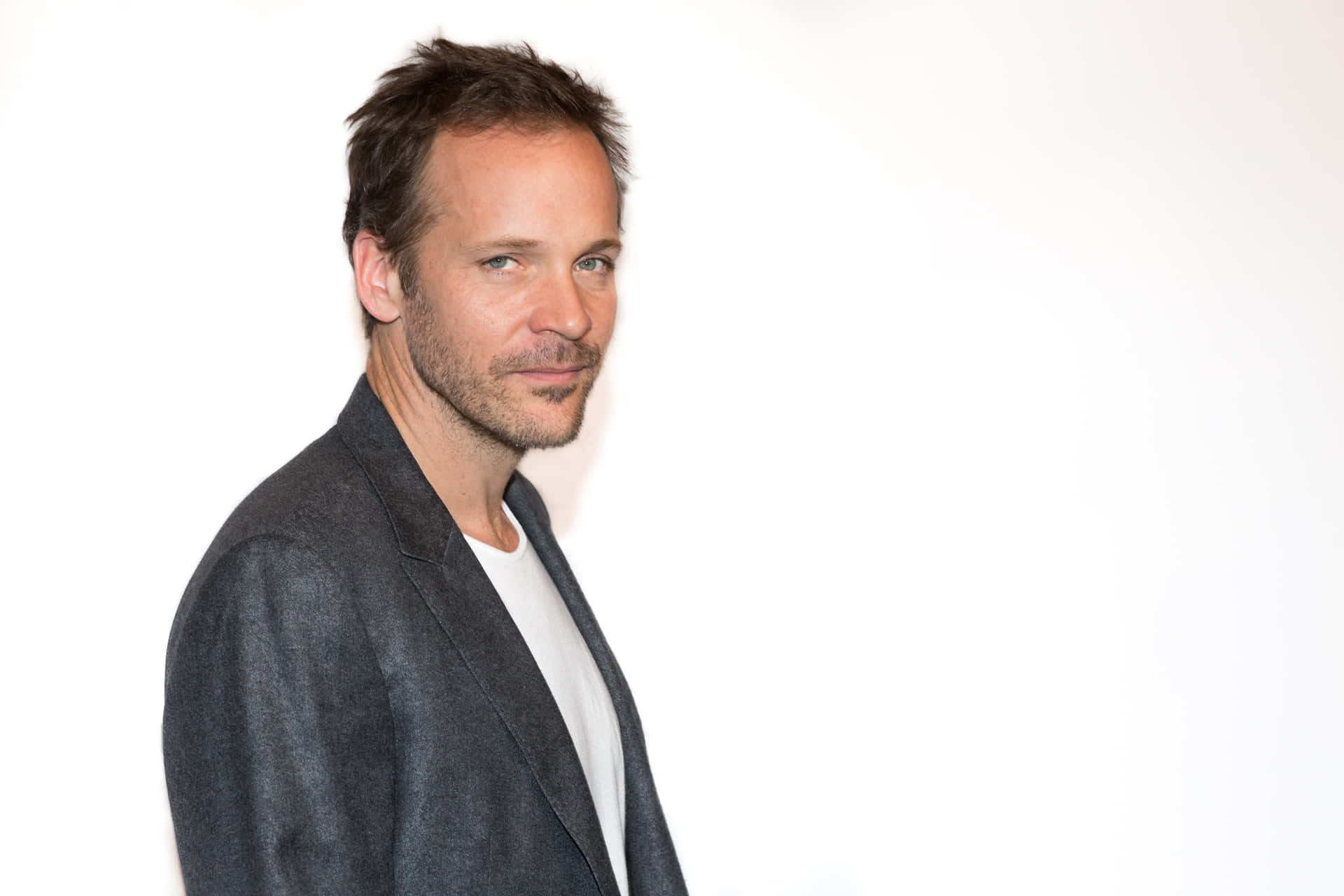 Caption: Peter Sarsgaard In Full Elegance. Background