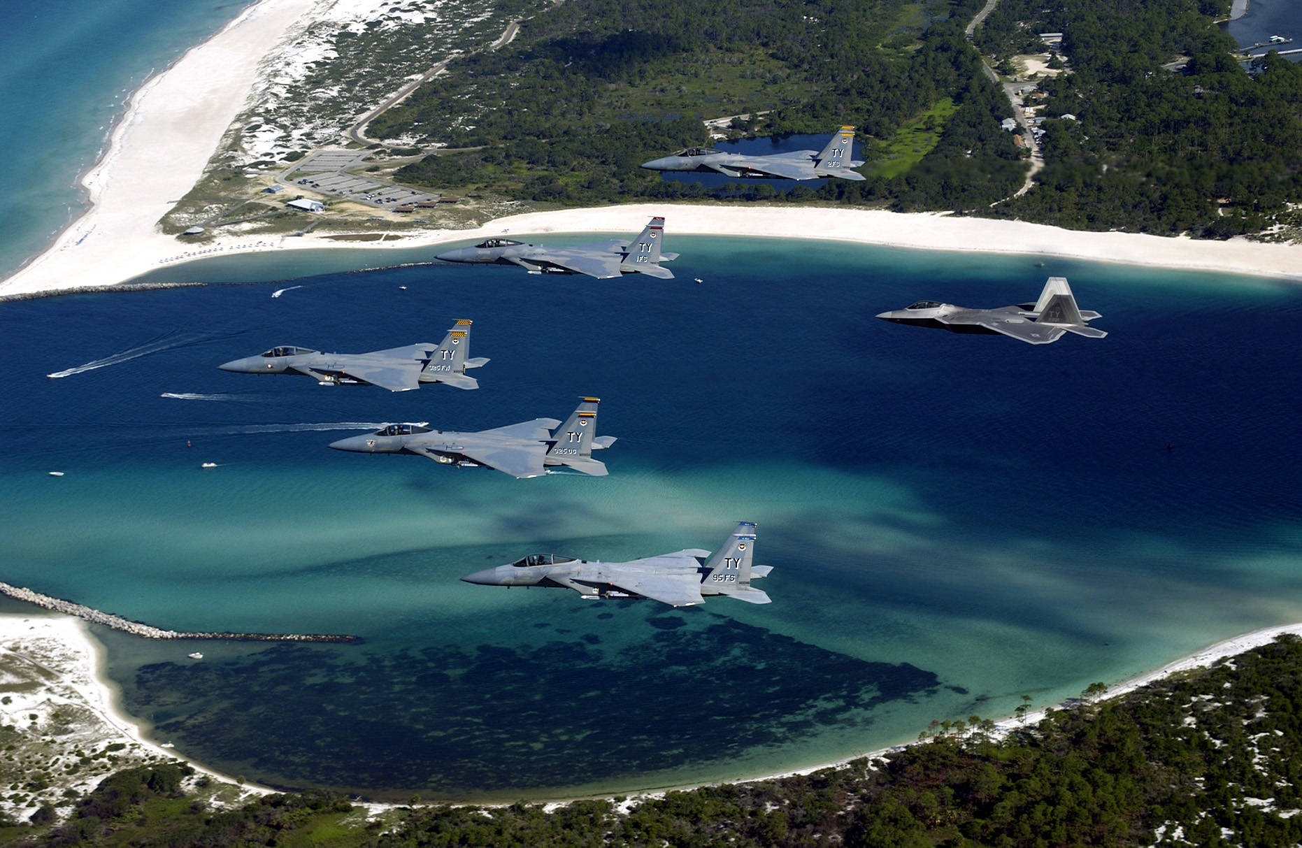 Caption: Power In Flight: F-15 Fighter Jet Soaring In The Sky Background