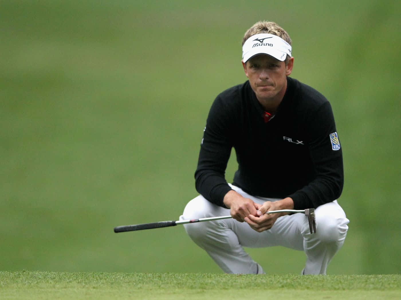 Caption: Professional Golfer Briny Baird In Action Background