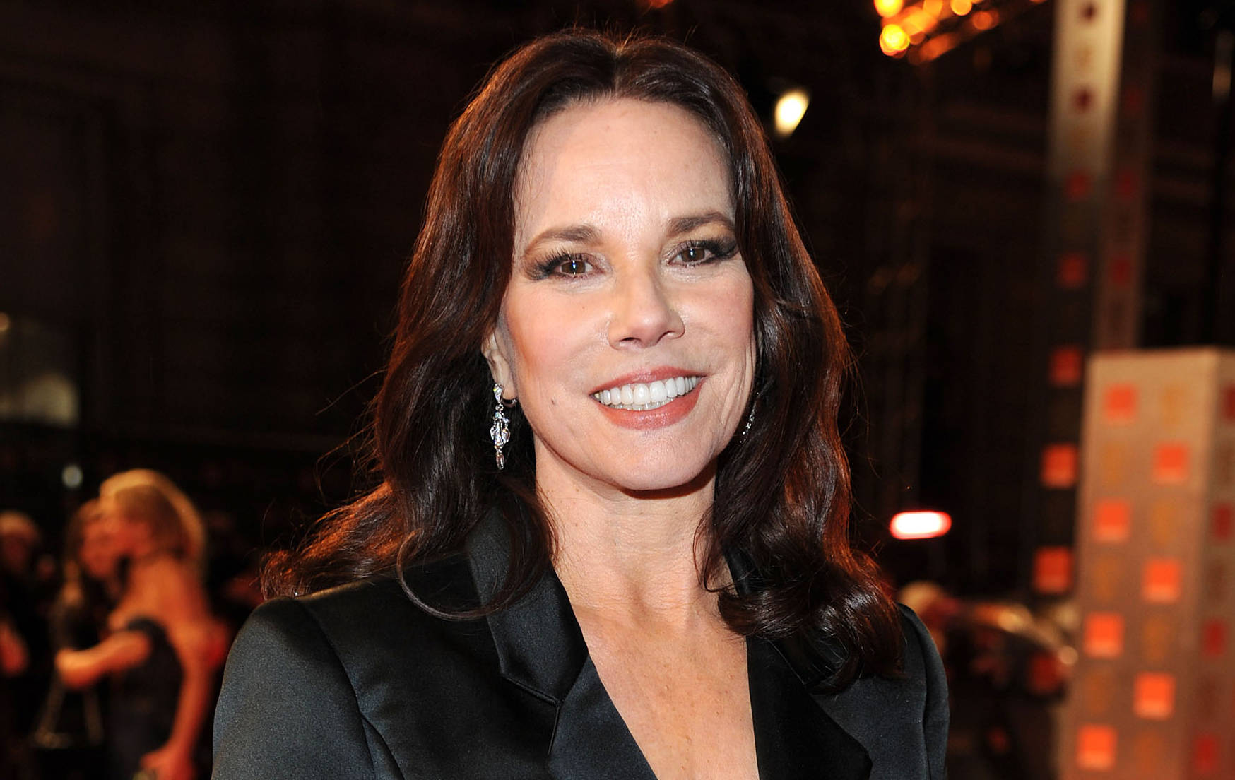 Caption: Prolific American Actress Barbara Hershey In A Poised And Elegant Pose. Background