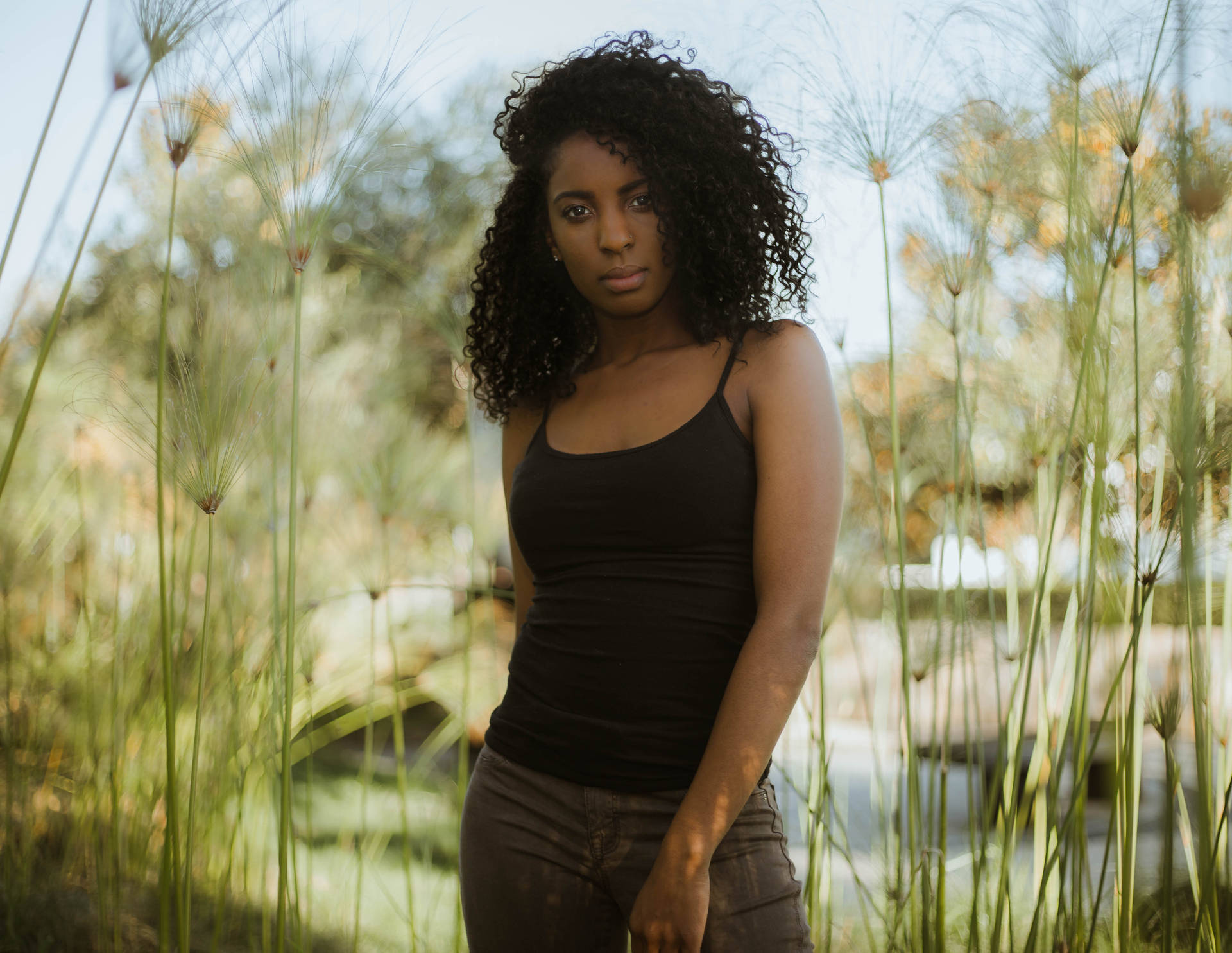 Caption: Radiant Confidence - Portrait Of A Beautiful Black Girl Background