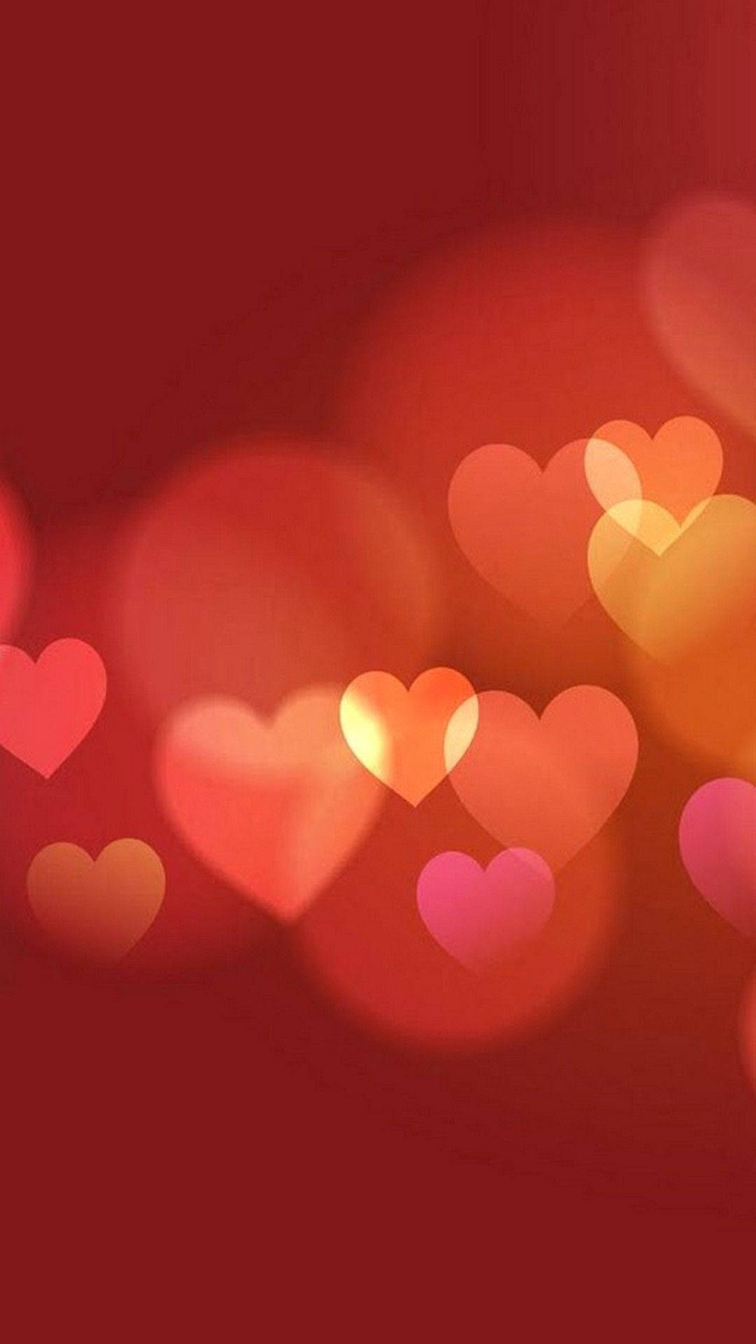 Caption: Radiant Heart On A Red Background For Iphone Display