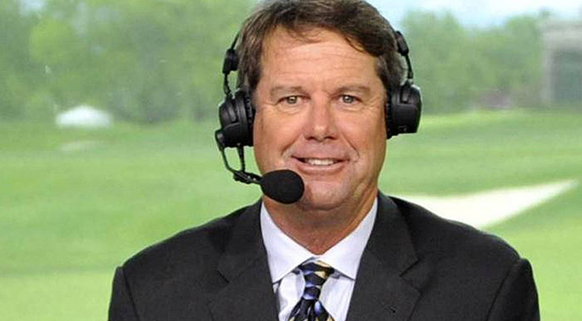 Caption: Renowned Golfer, Paul Azinger In Broadcasting Headset During A Golf Tournament Background