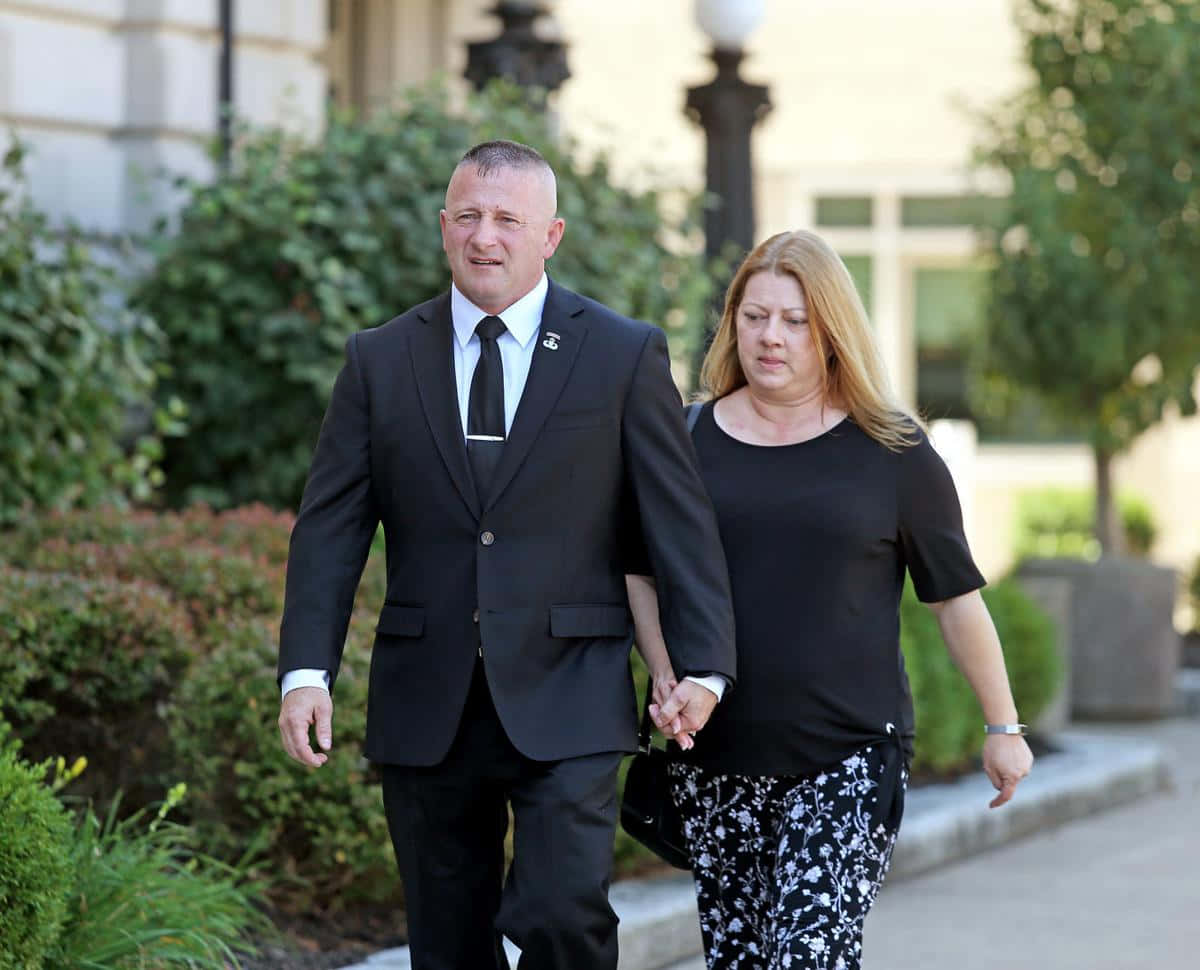 Caption: Richard Ojeda Holding Hands With Wife Background