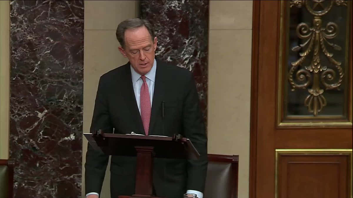 Caption: Senator Pat Toomey In Senate Chamber Background