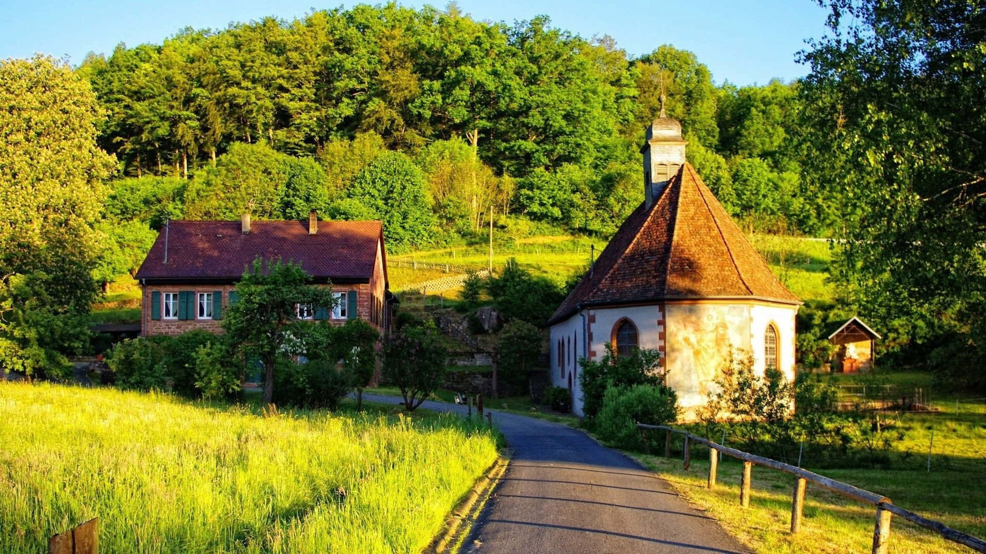 Caption: Serene English Village Nestled In The Lush Green Countryside