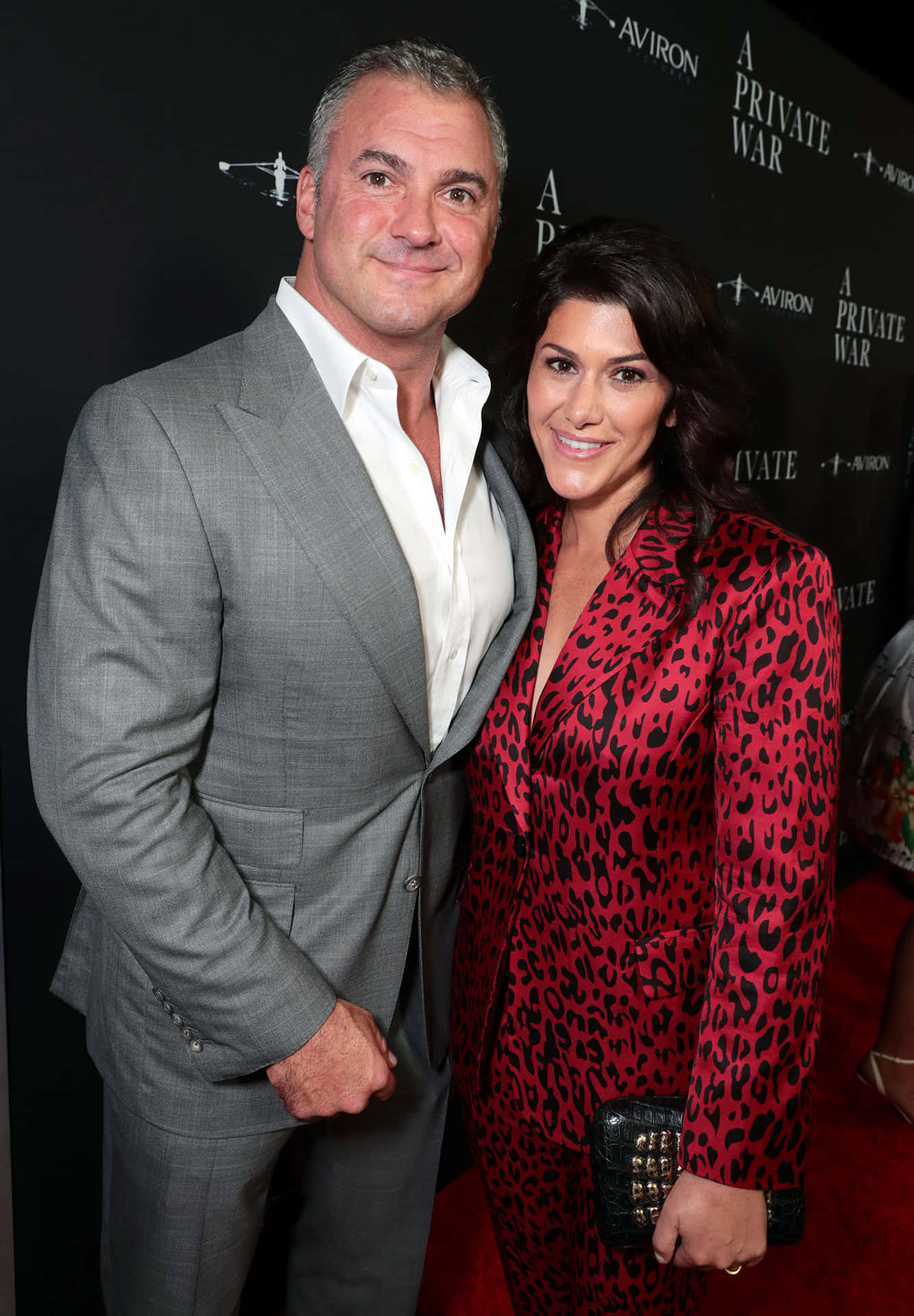 Caption: Shane Mcmahon With Marissa Mazzola Mcmahon Standing Together Background