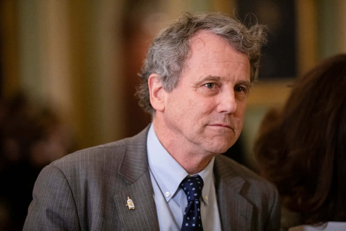 Caption: Sherrod Brown In Discussion At The Capitol Background