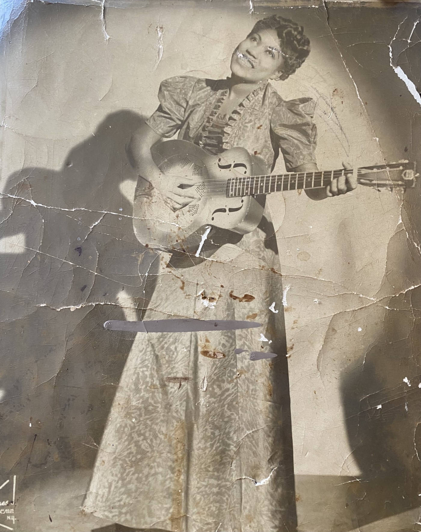 Caption: Sister Rosetta Tharpe Strumming Her Guitar On Vintage Photo