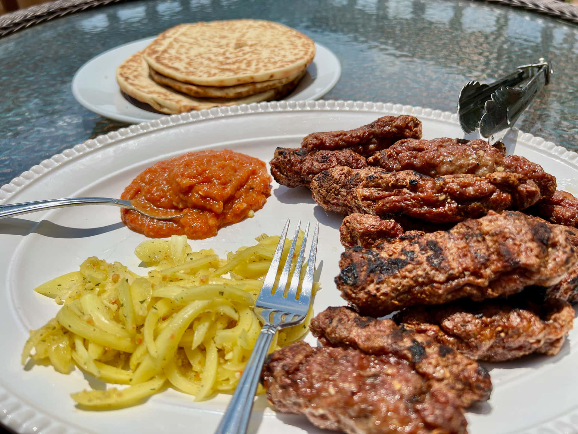 Caption: Sizzling Grilled Ćevapi Sausages With Onions Background