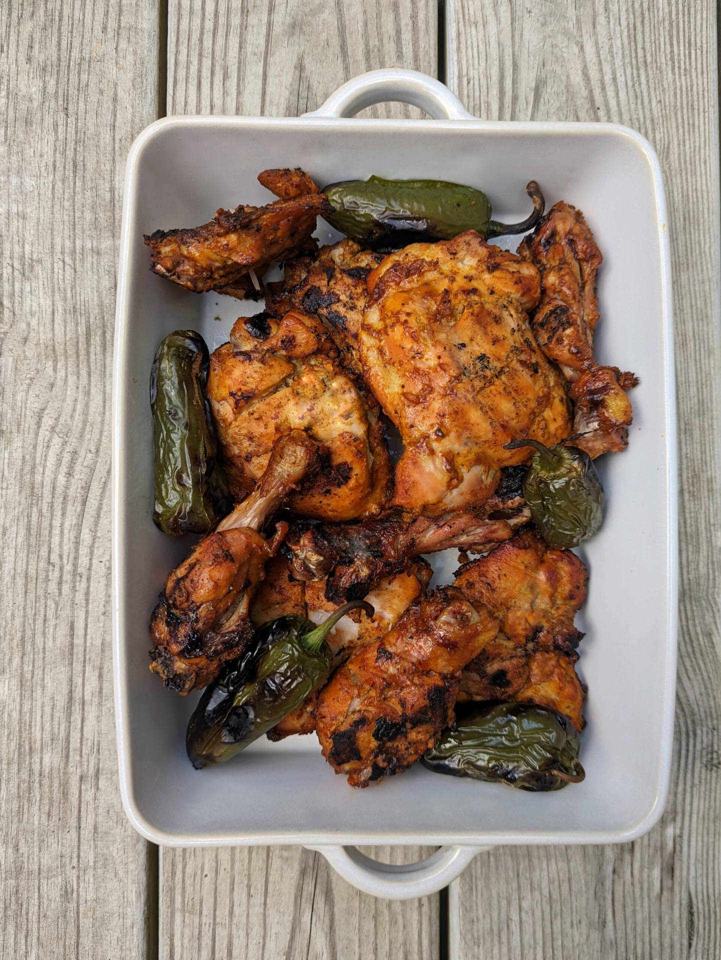 Caption: Sizzling Tandoori Chicken Fresh From The Oven Background