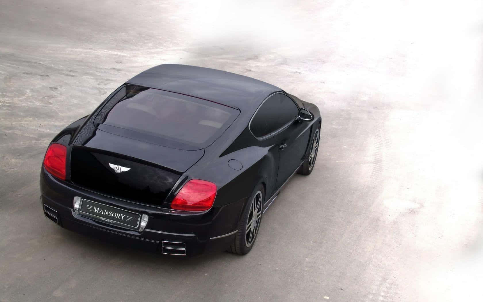 Caption: Sleek And Sophisticated Bentley Sport Background