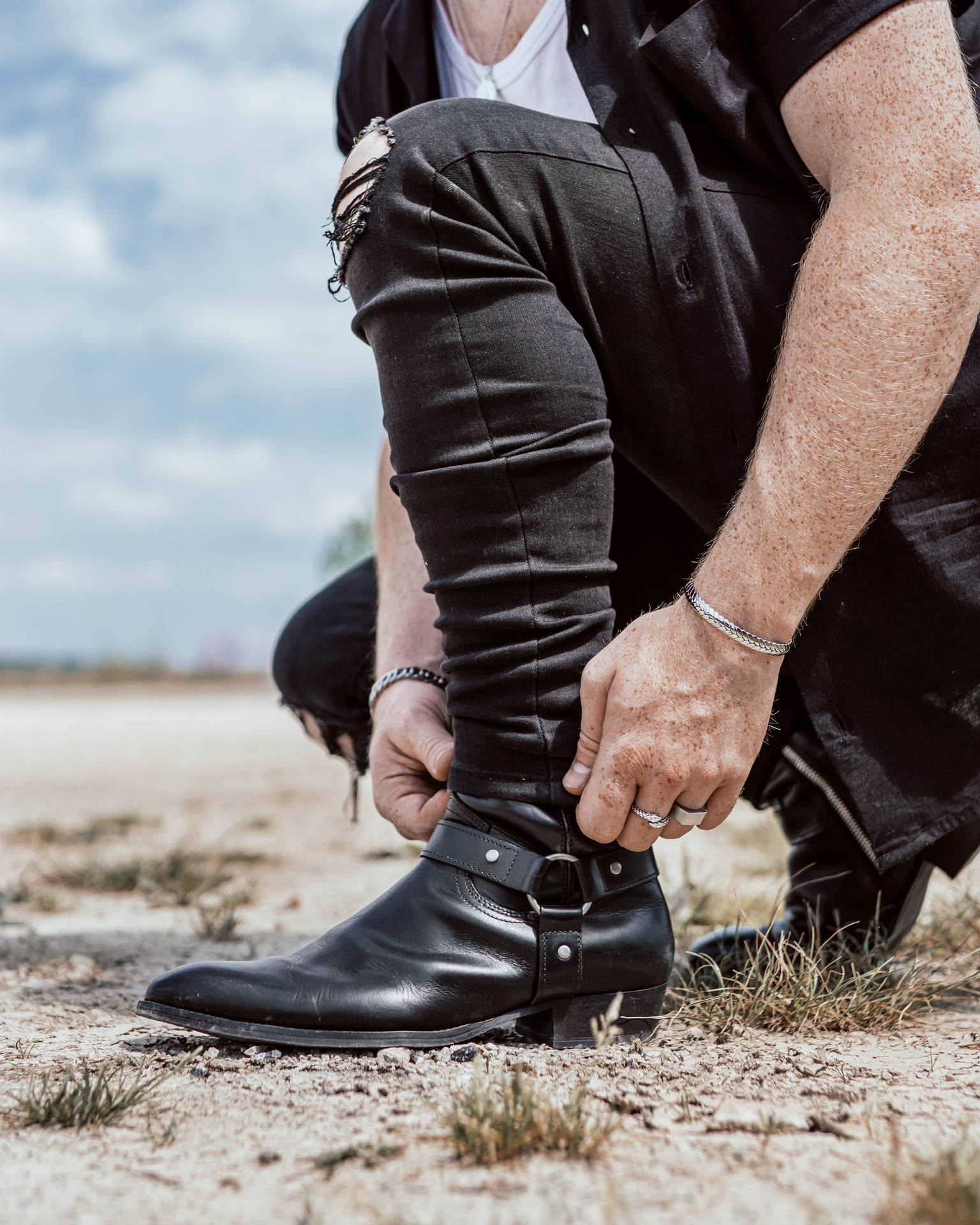 Caption: Sleek Black Strapped Leather Shoes Background