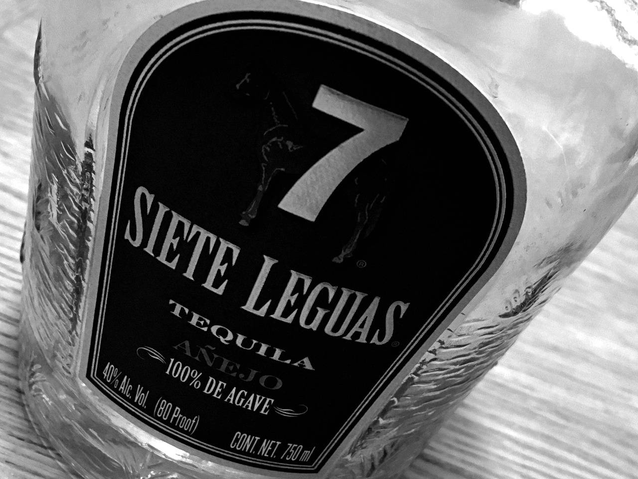 Caption: Sophisticated Siete Leguas Tequila Bottle In Monochrome Background