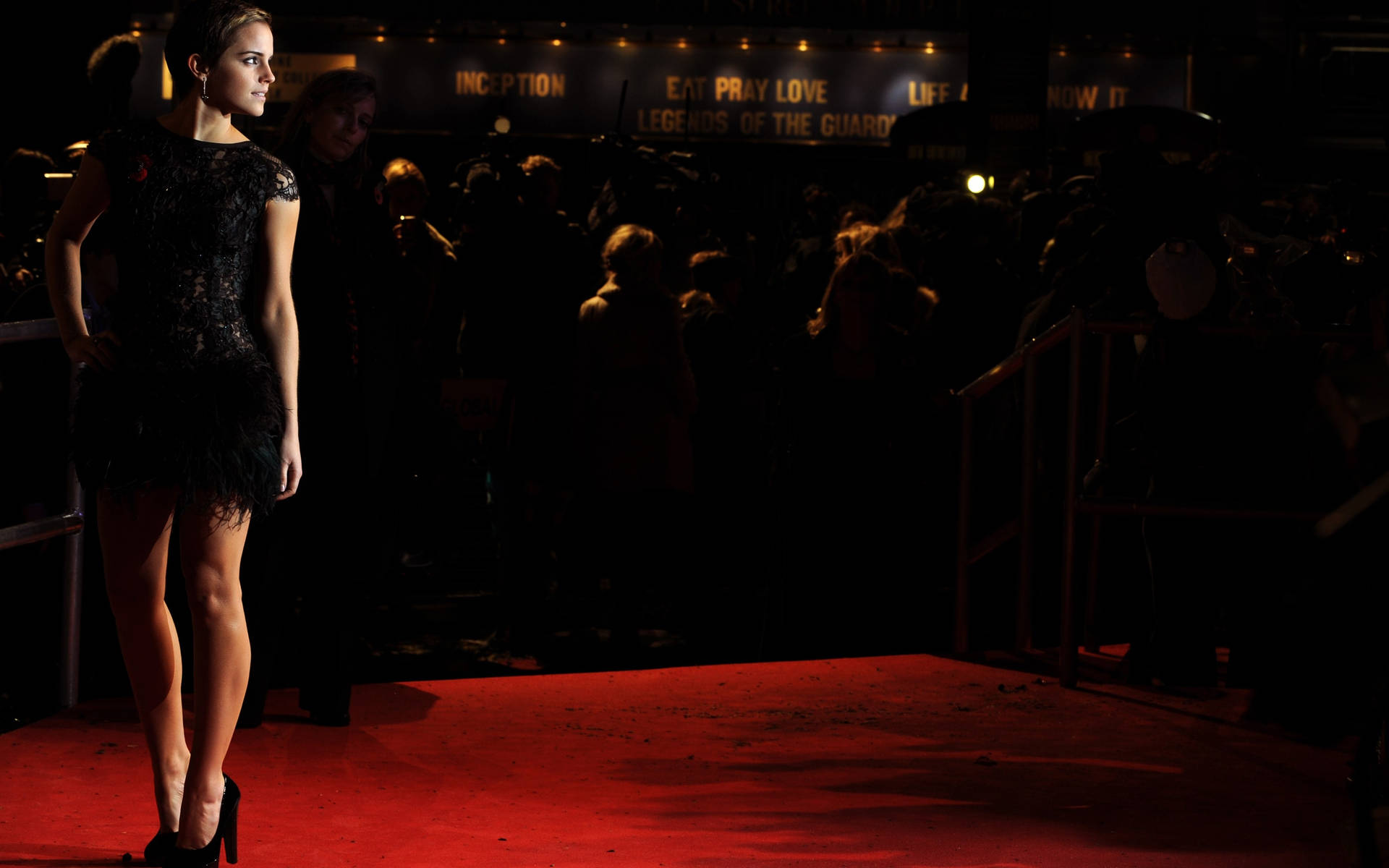 Caption: Sophisticated Stardom - A Star Poised On The Red Carpet Background