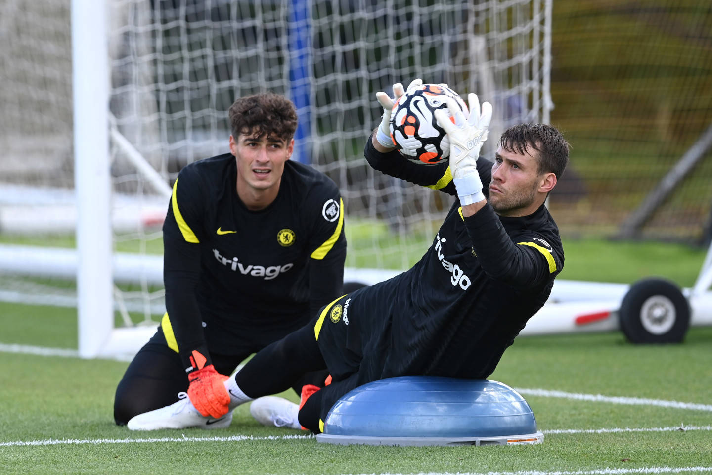 Caption: Spanish Goalkeeper Kepa Arrizabalaga Alongside English Keeper Marcus Bettinelli On The Pitch.