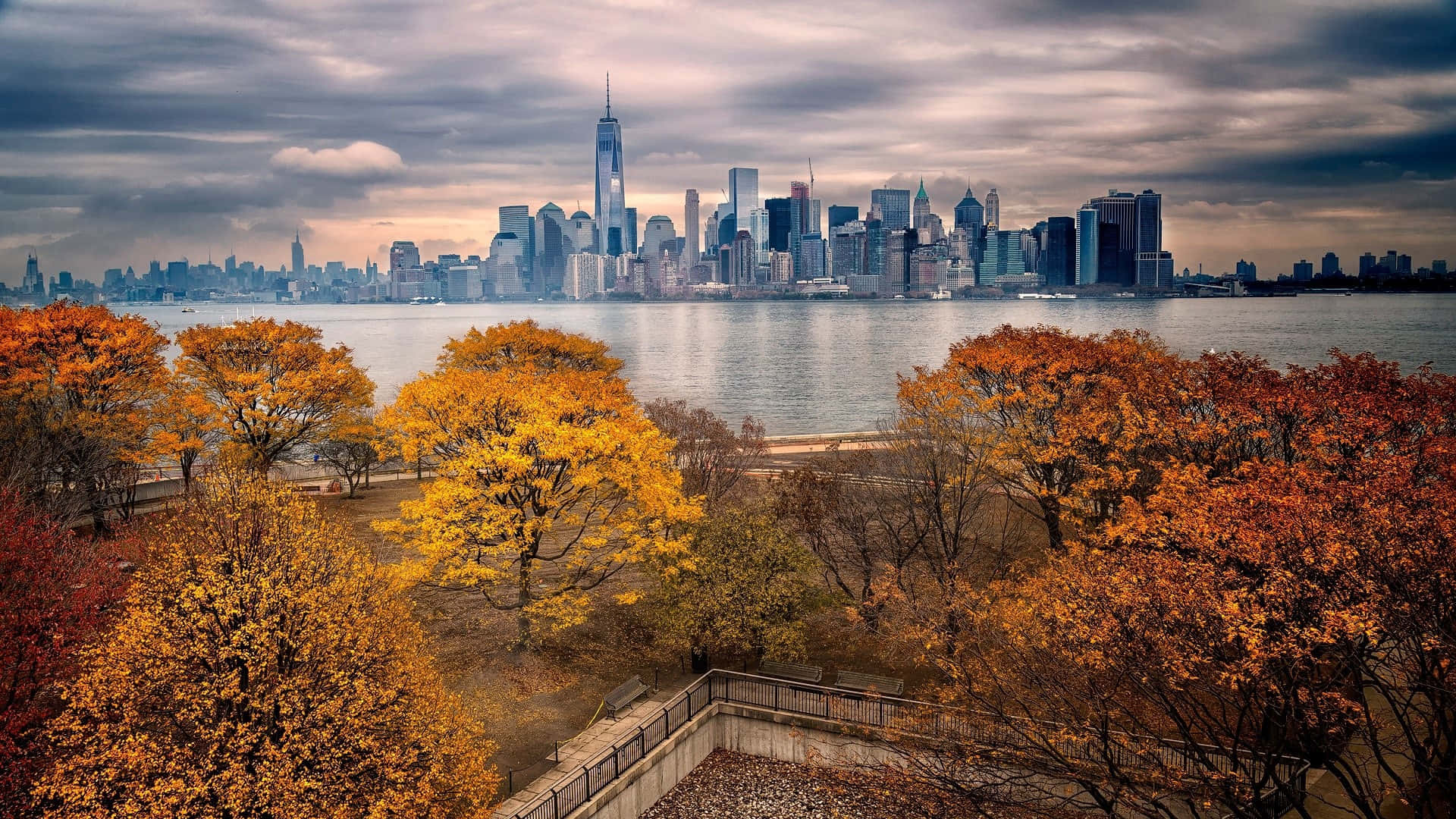 Caption: Spectacular Fall View Of The Freedom Tower On Liberty Island Background