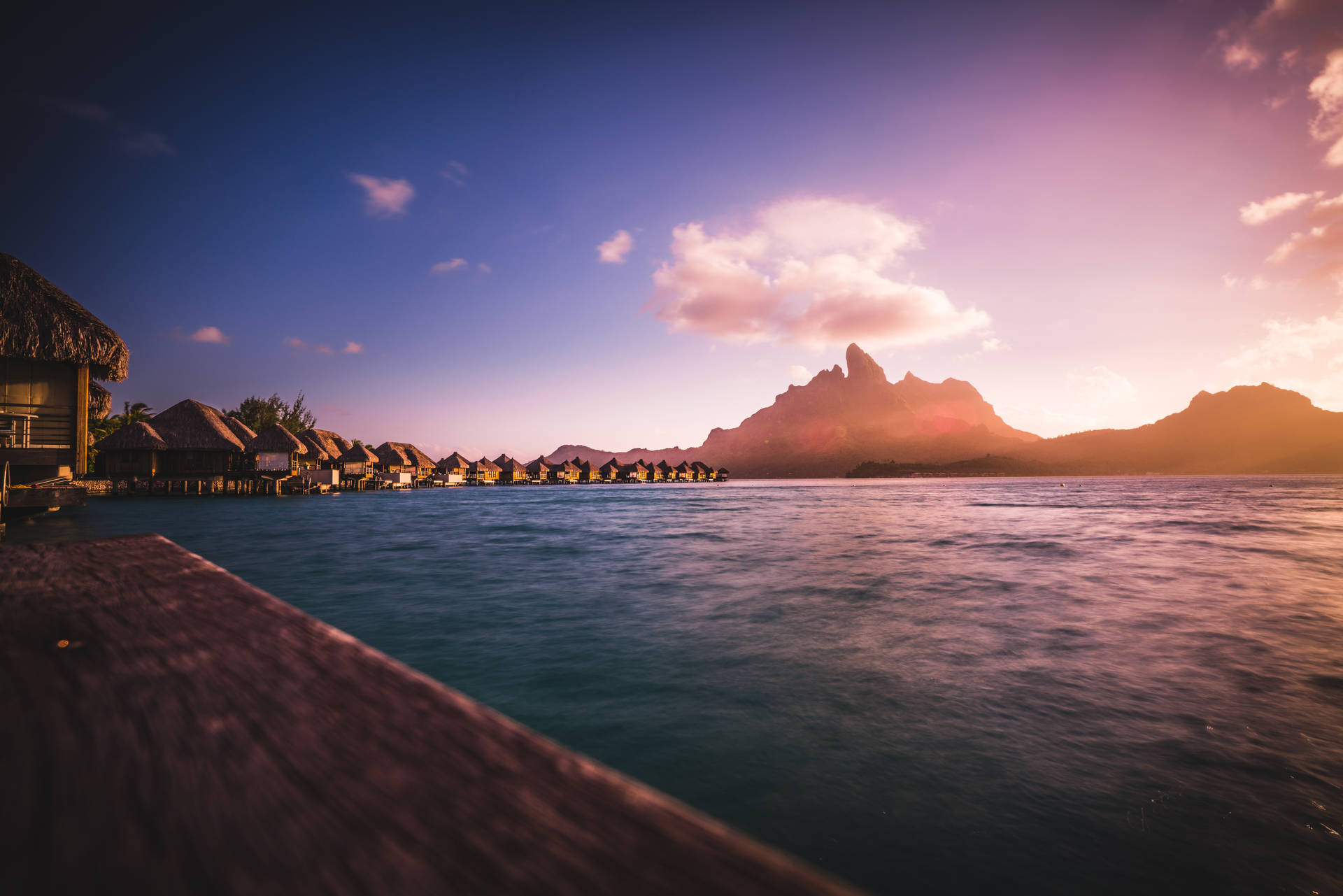 Caption: Spectacular Over-water Bungalows In French Polynesia Background