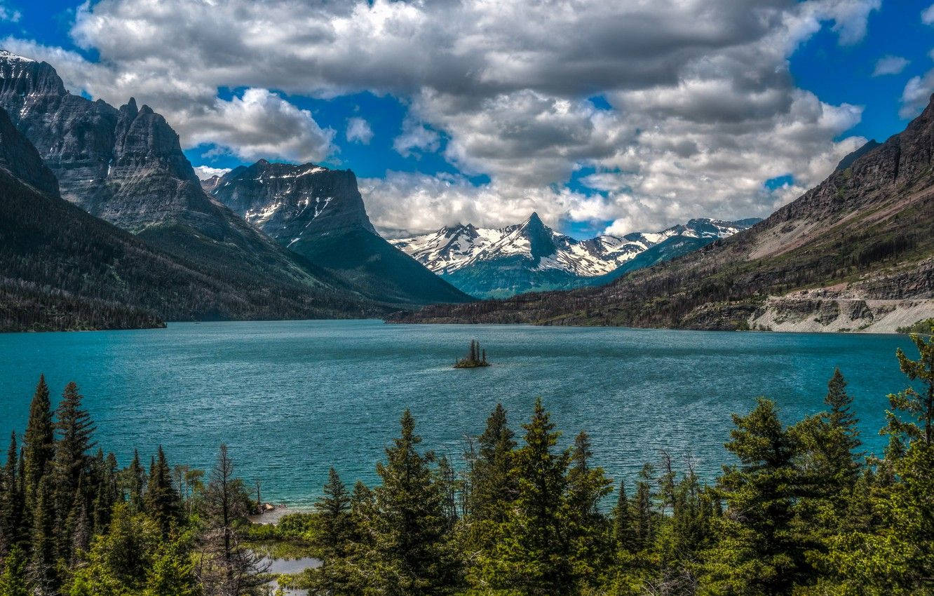 Caption: Spectacular View Of The Blue Lake At Glacier National Park Background