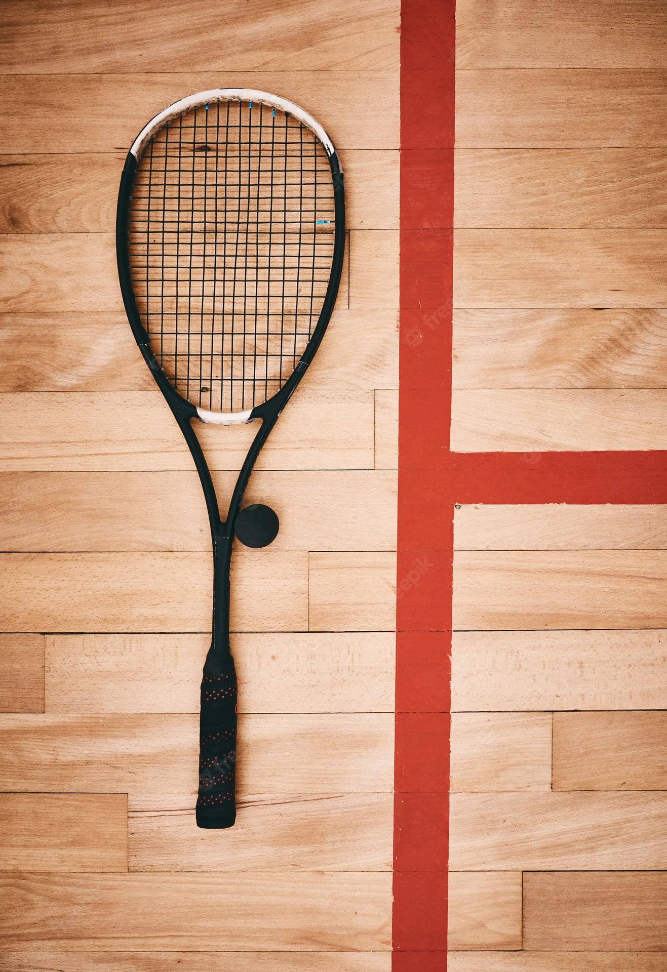 Caption: Squash Essentials - A Racket And Ball Beside The Red Line