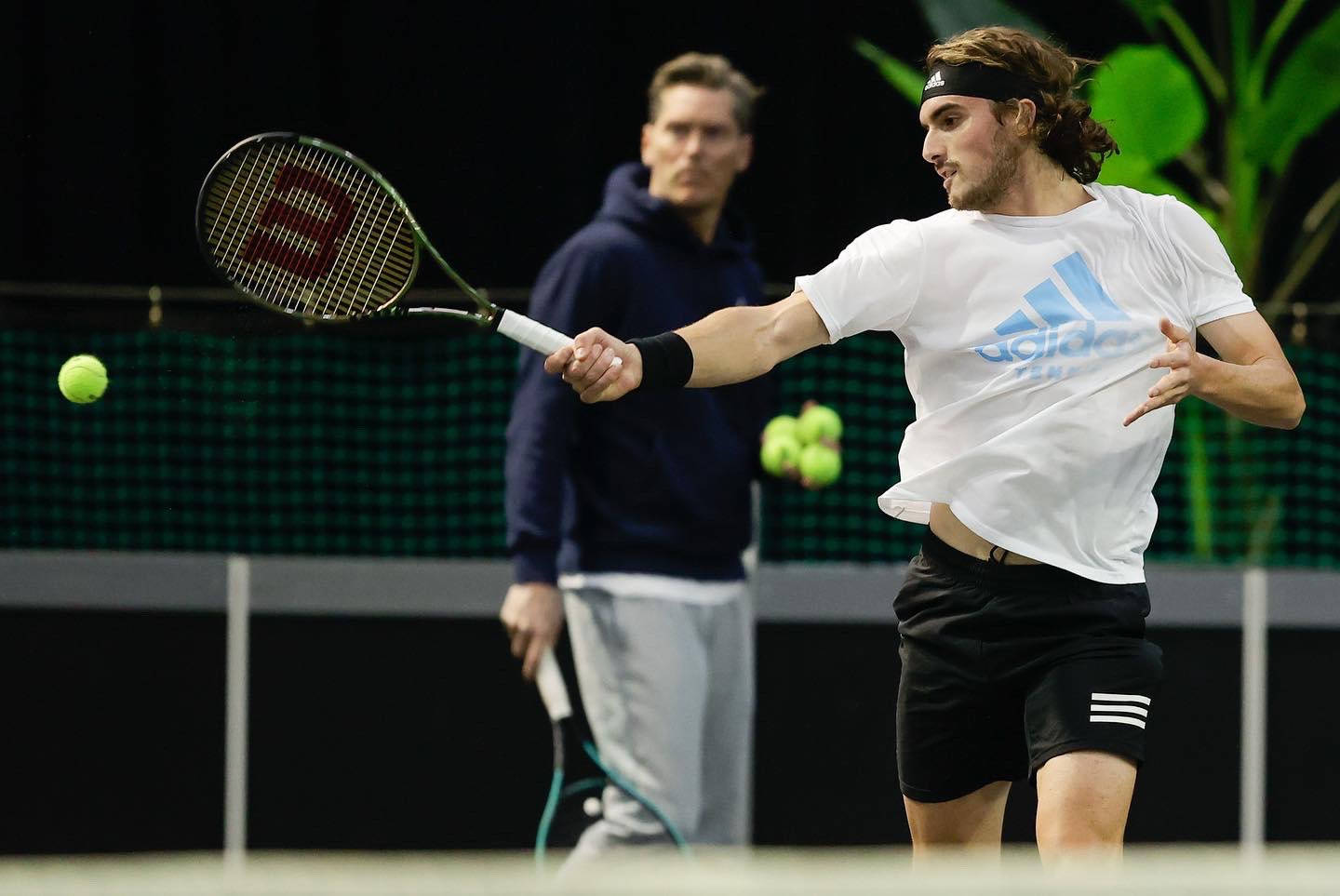 Caption: Stefanos Tsitsipas Alongside Mentor Thomas Enqvist. Background