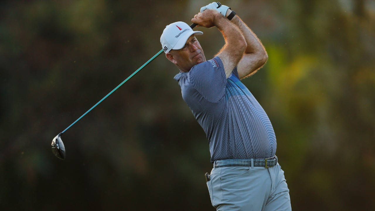 Caption: Stewart Cink In Mid Swing On The Green