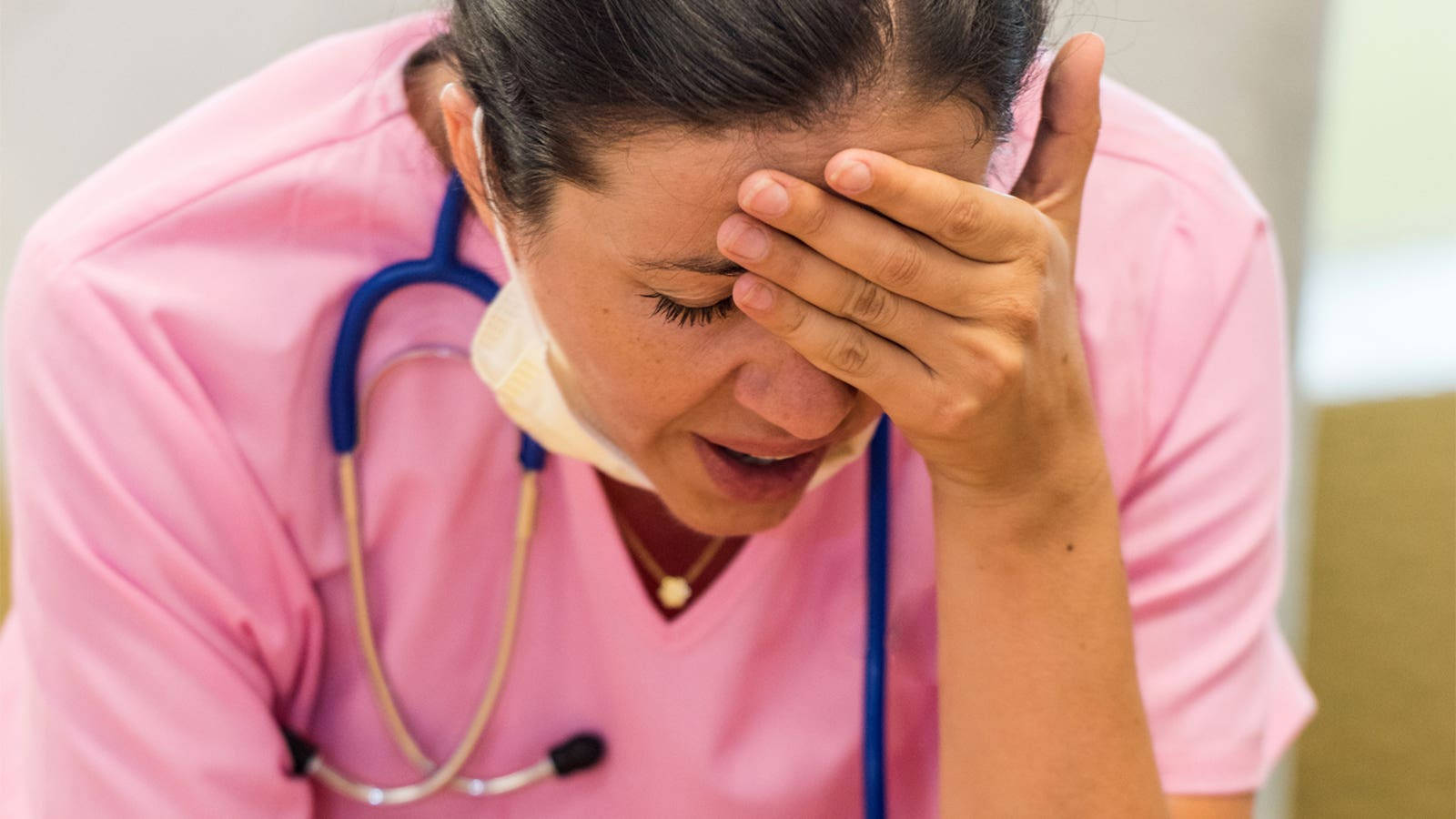 Caption: Stressed Female Nurse Fighting Headache Background