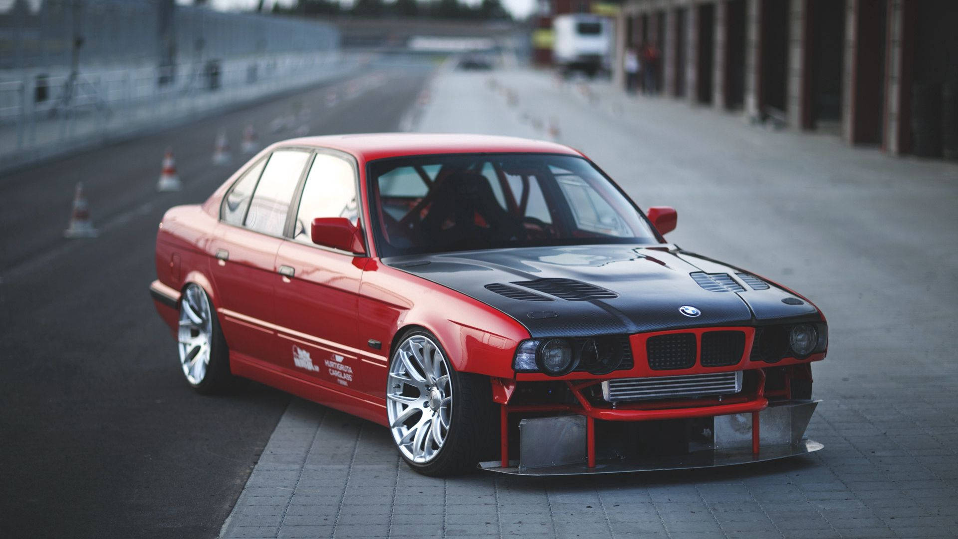 Caption: Striking Red Bmw E34 In Full Hd Background