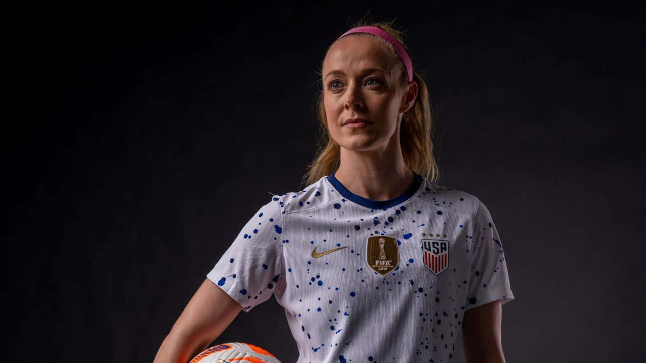 Caption: Strong And Fierce: Becky Sauerbrunn In Action Background