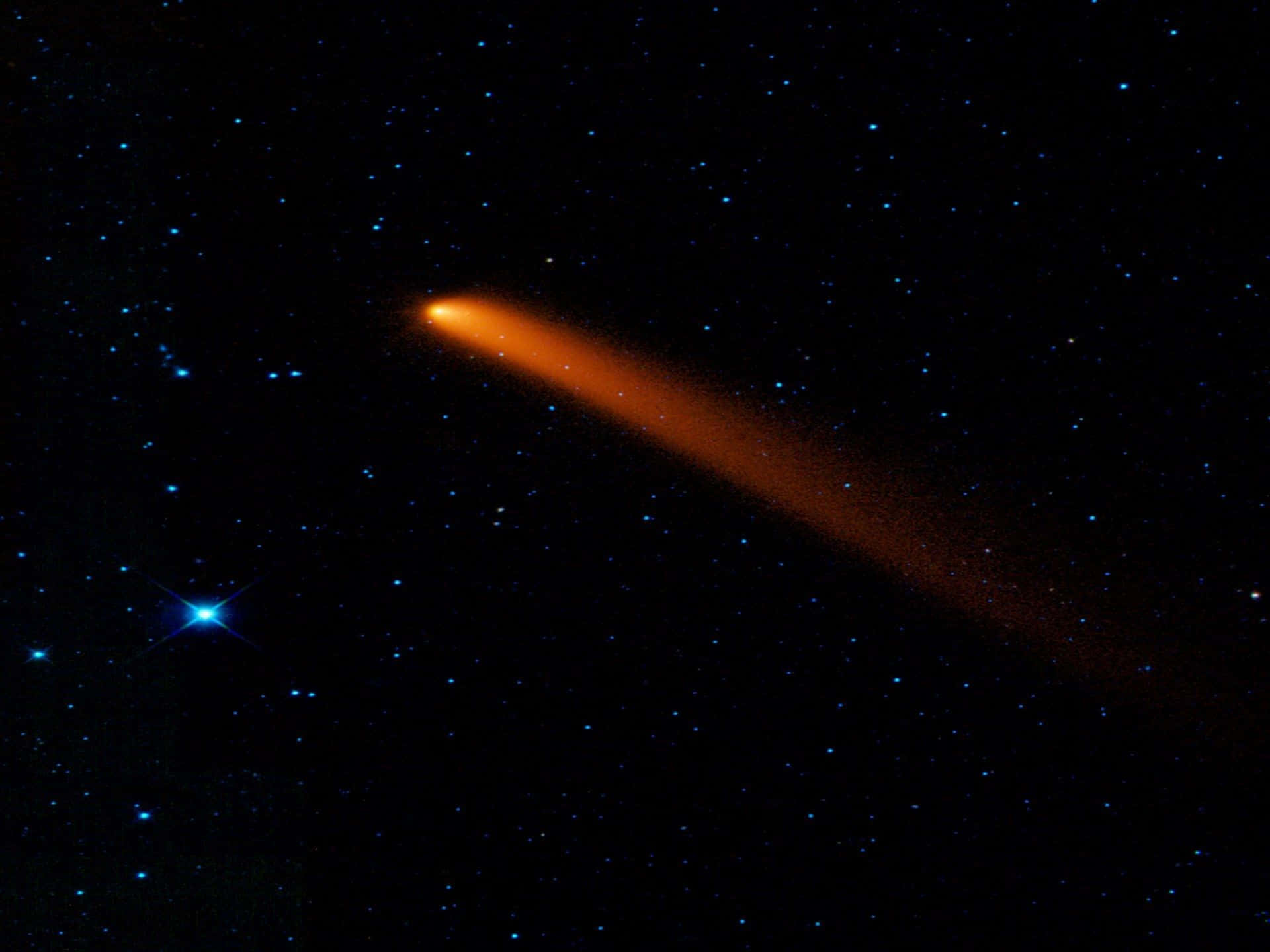 Caption: Stunning Comet Illuminating The Night Sky Background