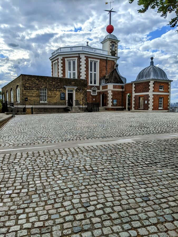 Caption: Stunning Night View Of The Royal Observatory In Greenwich Background