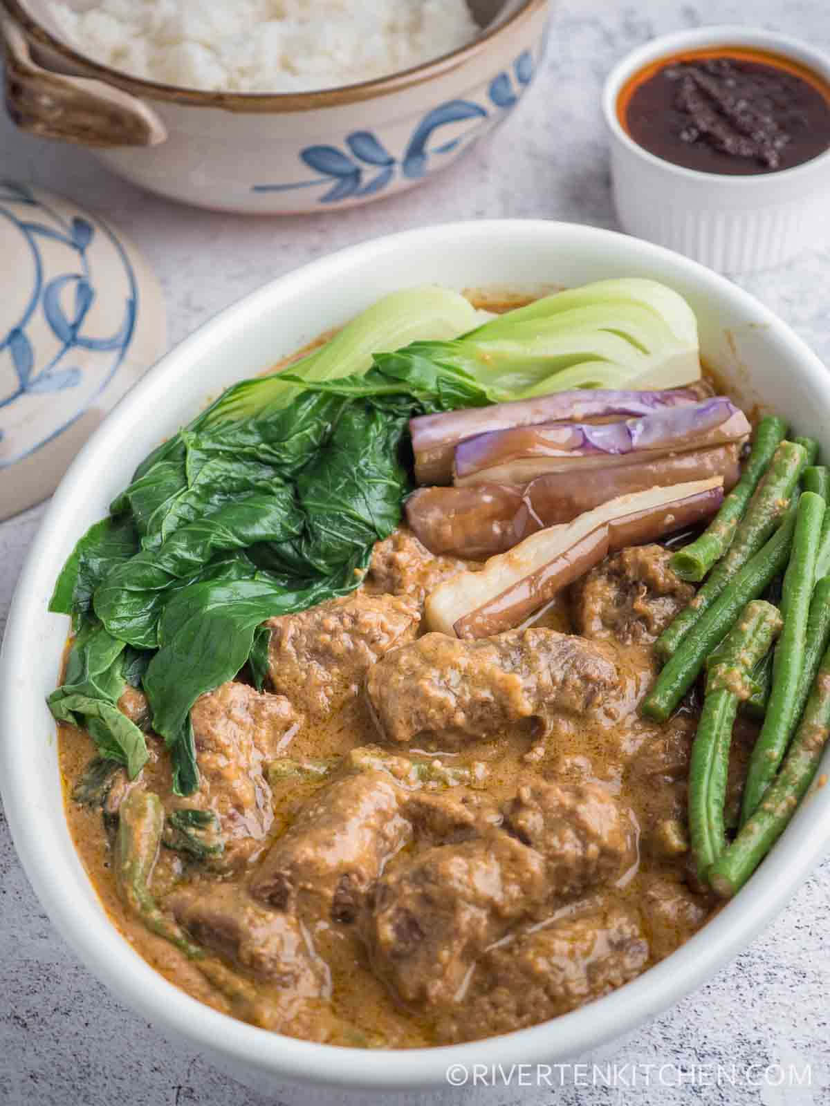 Caption: Succulent Filipino Dish, Kare-kare Background