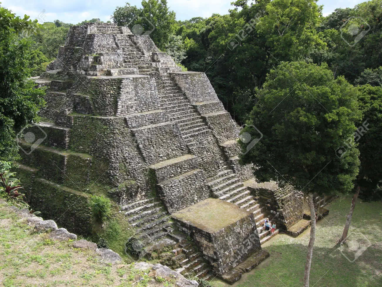 Caption: Sunlit View Of The Ancient Mayan Ruins Of Copan Background